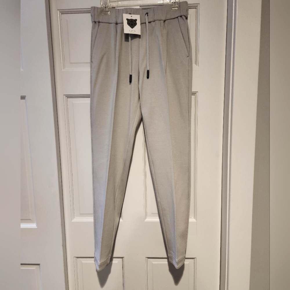 Lita by Ciara luxe and chic Taper Pant, NWT, size Medium.